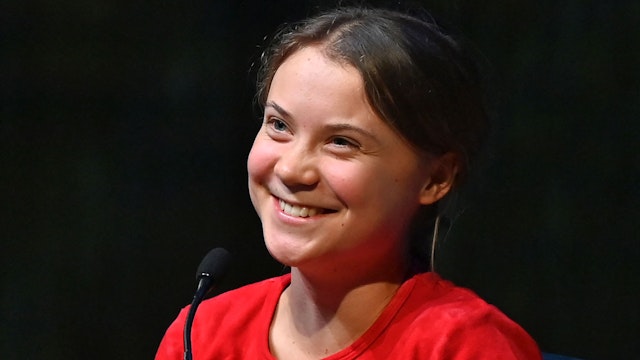 Swedish climate activist Greta Thunberg smiles as she speaks on stage during the launch of her latest book "The Climate Book" at the Southbank Centre's Royal Festival Hall in central London on October 30, 2022.