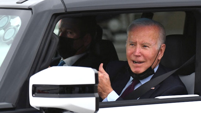 US President Joe Biden test drives an electric hummer as he tours the General Motors Factory ZERO electric vehicle assembly plant in Detroit, Michigan on November 17, 2021.