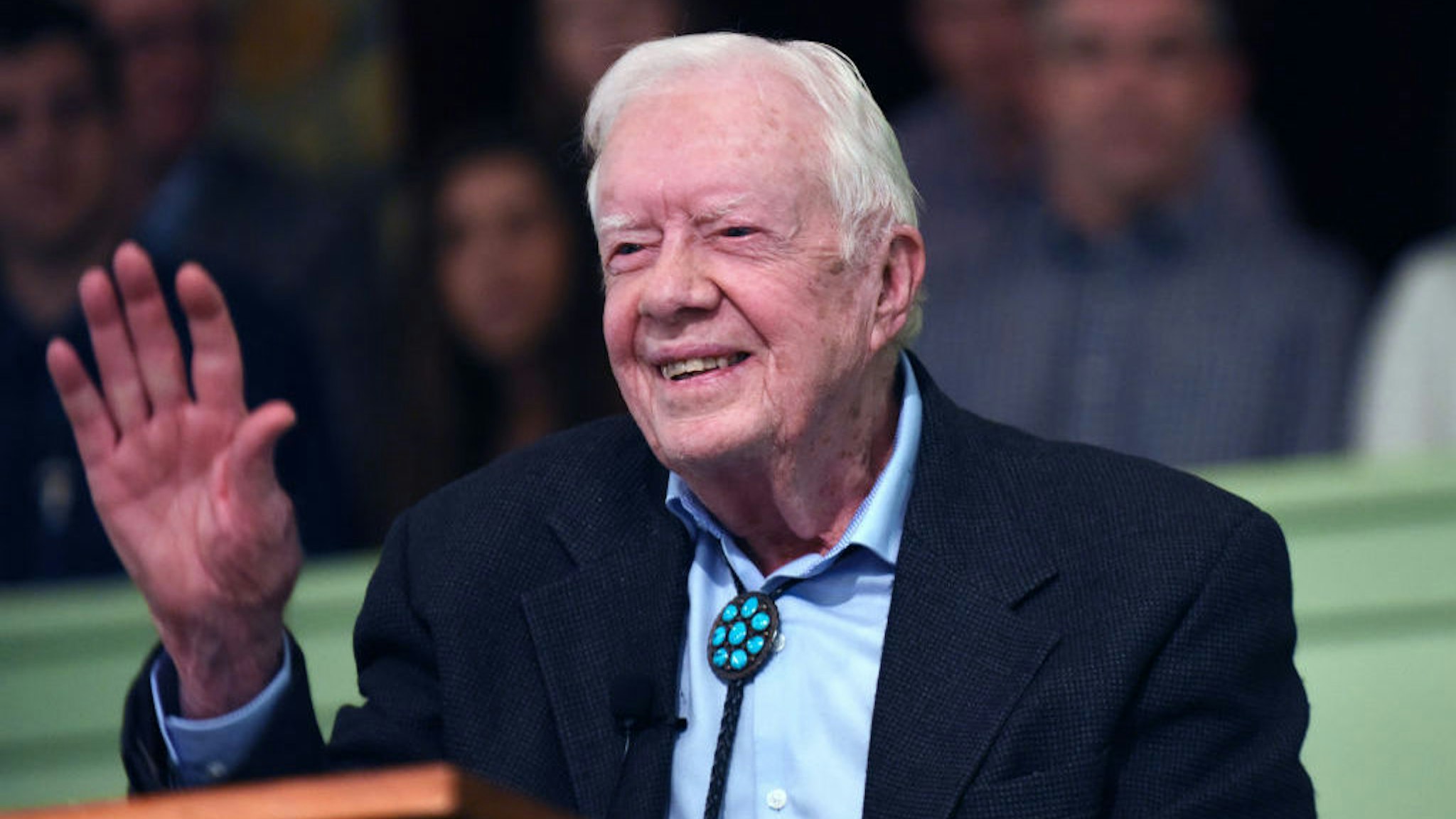 Former U.S. President Jimmy Carter waves to the congregation after teaching Sunday school at Maranatha Baptist Church in his hometown of Plains, Georgia on April 28, 2019. Carter, 94, has taught Sunday school at the church on a regular basis since leaving the White House in 1981, drawing hundreds of visitors who arrive hours before the 10:00 am lesson in order to get a seat and have a photograph taken with the former President and former First Lady Rosalynn Carter. (Photo by Paul Hennessy/NurPhoto via Getty Images)