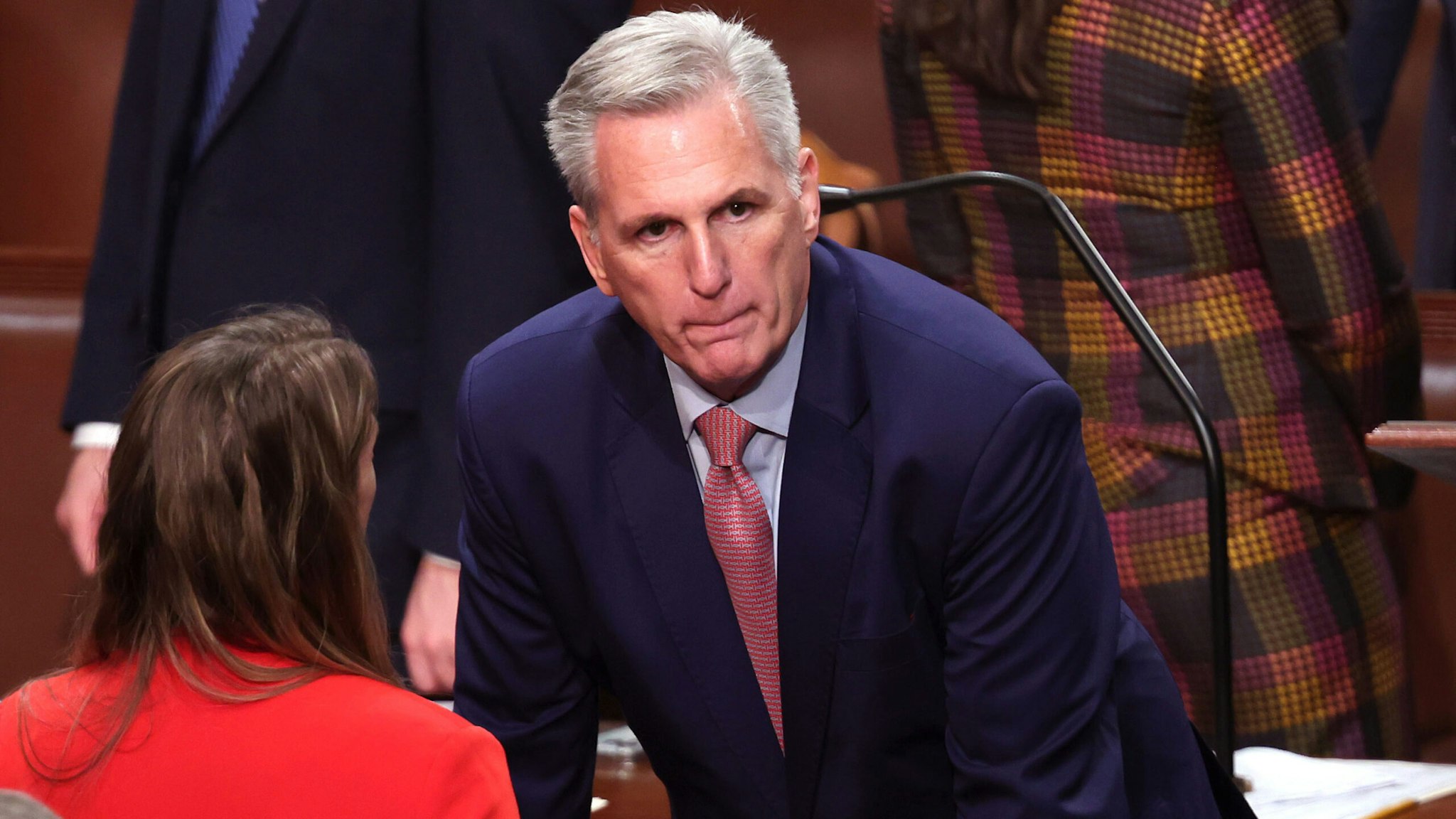 WASHINGTON, DC - JANUARY 03: U.S. House Minority Leader Kevin McCarthy (R-CA) (C) talks to a colleague as Rep. Jim Jordan (R-OH) works behind him, as the House of Representatives cast their votes for Speaker of the House, on the first day of the 118th Congress in the House Chamber of the U.S. Capitol Building on January 03, 2023 in Washington, DC. Today members of the 118th Congress will be sworn-in and the House of Representatives will elect a new Speaker of the House.