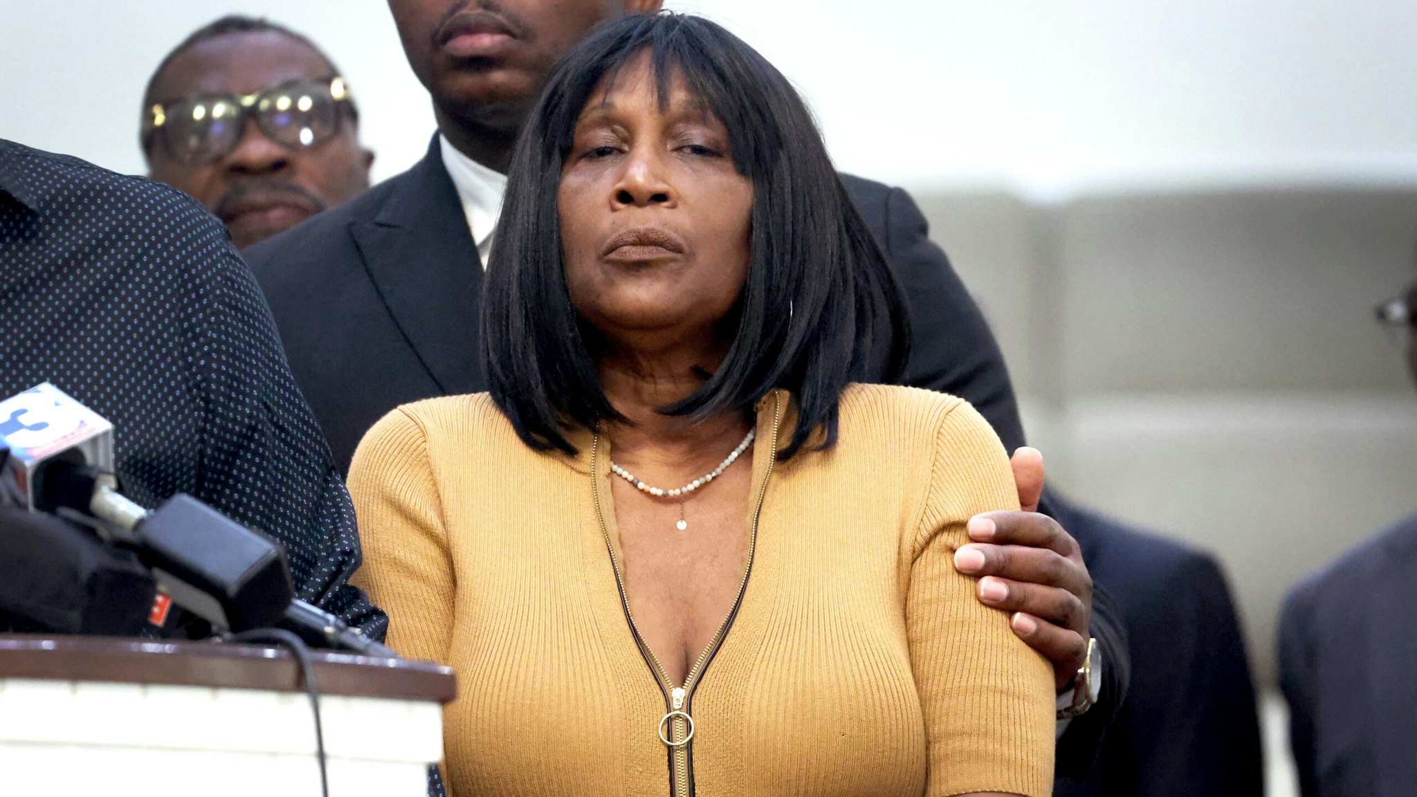 MEMPHIS, TENNESSEE - JANUARY 27: RowVaughn Wells, mother of Tyre Nichols, is comforted during a press conference on January 27, 2023 in Memphis, Tennessee. Tyre Nichols, a 29-year-old Black man, died three days after being severely beaten by five Memphis Police Department officers during a traffic stop on January 7, 2023. Memphis and cities across the country are bracing for potential unrest when the city releases video footage from the beating to the public later this evening.