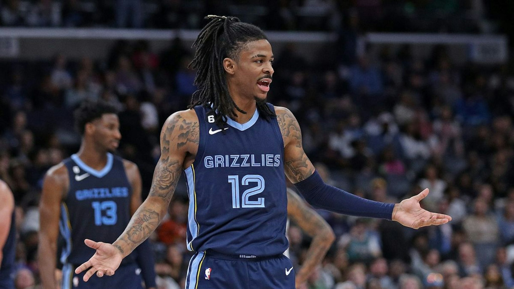 Ja Morant #12 of the Memphis Grizzlies reacts during the game against the Sacramento Kings at FedExForum on January 01, 2023 in Memphis, Tennessee.