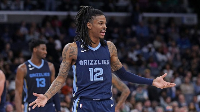 Ja Morant #12 of the Memphis Grizzlies reacts during the game against the Sacramento Kings at FedExForum on January 01, 2023 in Memphis, Tennessee.