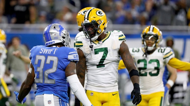 Quay Walker #7 of the Green Bay Packers and D'Andre Swift #32 of the Detroit Lions react in the fourth quarter at Ford Field on November 06, 2022 in Detroit, Michigan.