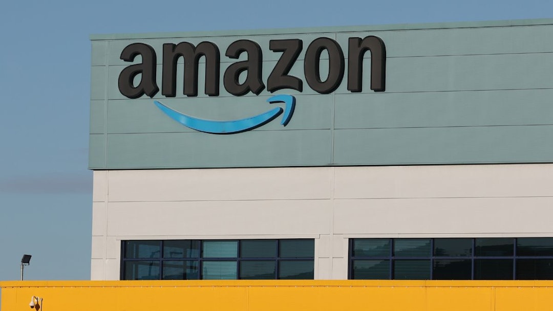 The Amazon logo is displayed outside the Amazon UK Services Ltd Warehouse on December 07, 2022 in Warrington, England.
