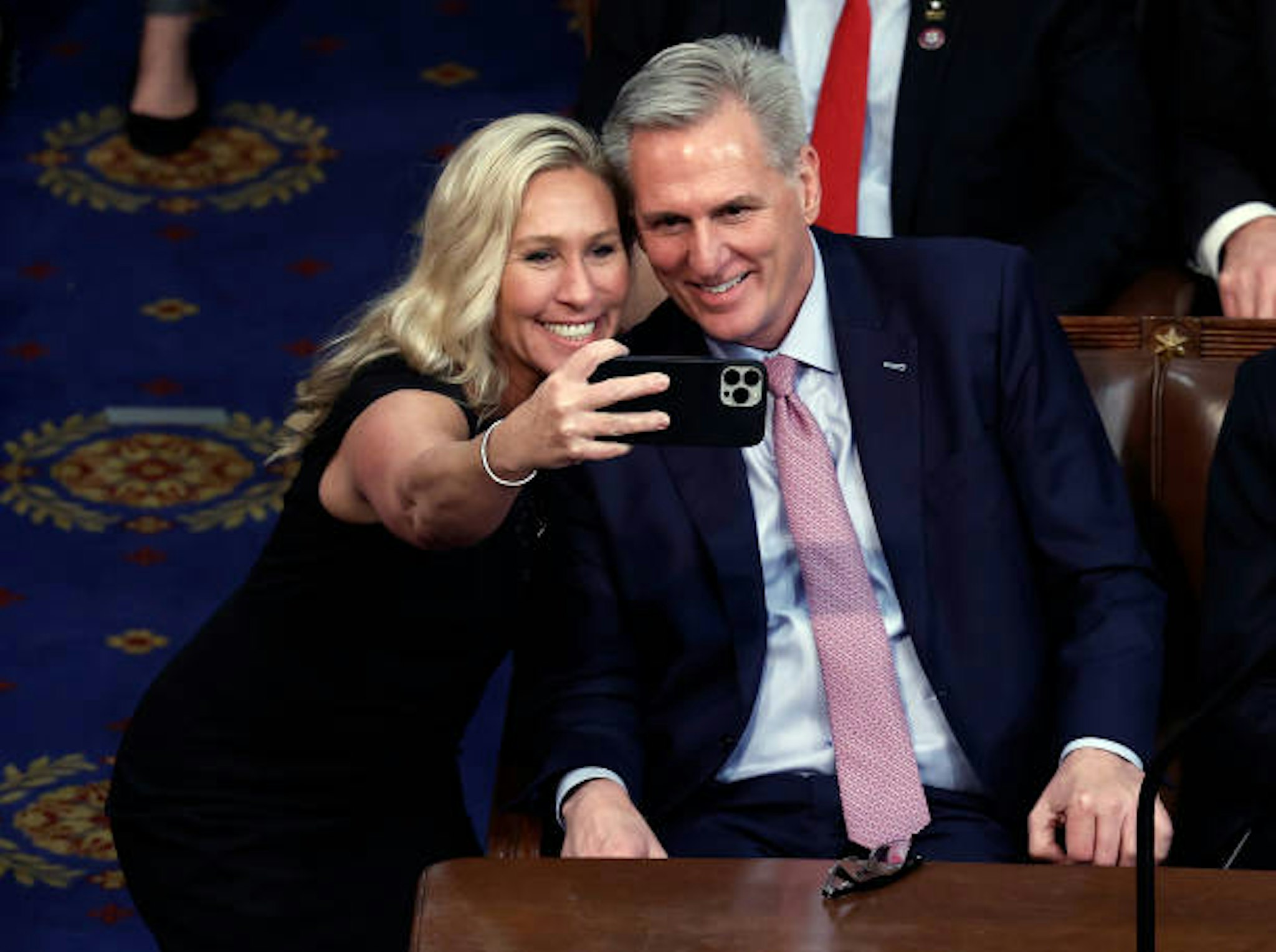 WASHINGTON, DC - JANUARY 06: Rep.-elect Marjorie Taylor Greene (R-GA) takes a photo with U.S. House Republican Leader Kevin McCarthy (R-CA) after being elected Speaker of the House in the House Chamber at the U.S. Capitol Building on January 07, 2023 in Washington, DC. After four days of voting and 15 ballots McCarthy secured enough votes to become Speaker of the House for the 118th Congress. (Photo by Anna Moneymaker/Getty Images)