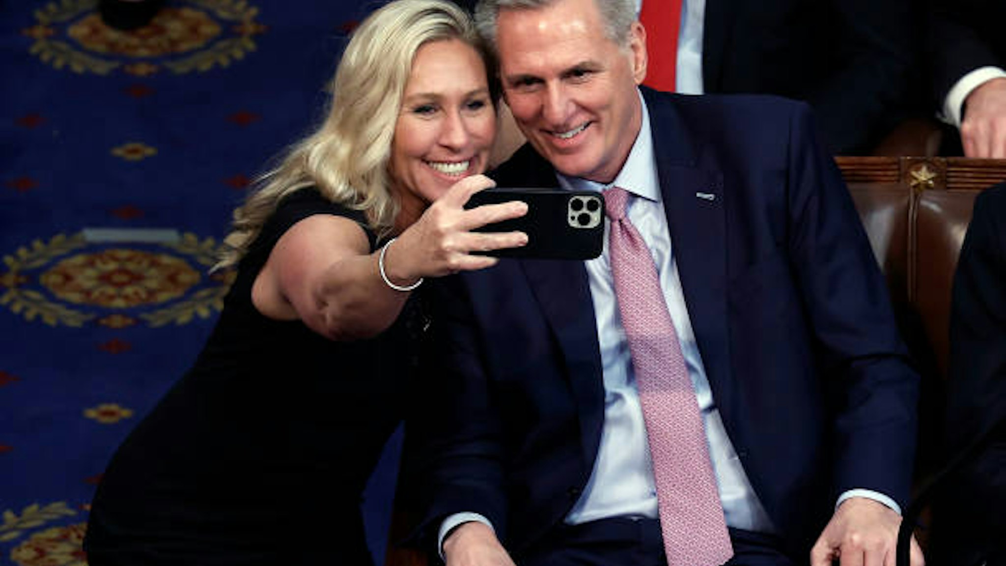WASHINGTON, DC - JANUARY 06: Rep.-elect Marjorie Taylor Greene (R-GA) takes a photo with U.S. House Republican Leader Kevin McCarthy (R-CA) after being elected Speaker of the House in the House Chamber at the U.S. Capitol Building on January 07, 2023 in Washington, DC. After four days of voting and 15 ballots McCarthy secured enough votes to become Speaker of the House for the 118th Congress. (Photo by Anna Moneymaker/Getty Images)