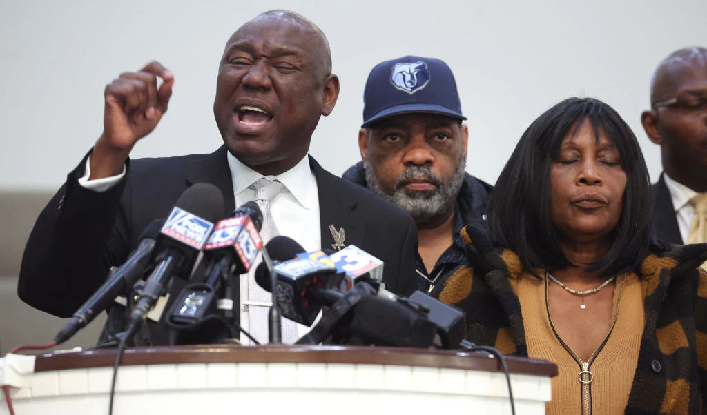 MEMPHIS, TENNESSEE - JANUARY 27: Flanked by Rodney Wells (C) and RowVaughn Wells, the stepfather and mother of Tyre Nichols, civil rights attorney Ben Crump speaks during a press conference on January 27, 2023 in Memphis, Tennessee. Tyre Nichols, a 29-year-old Black man, died three days after being severely beaten by five Memphis Police Department officers during a traffic stop on January 7, 2023. Memphis and cities across the country are bracing for potential unrest when the city releases video footage from the beating to the public later this evening. (Photo by Scott Olson/Getty Images)