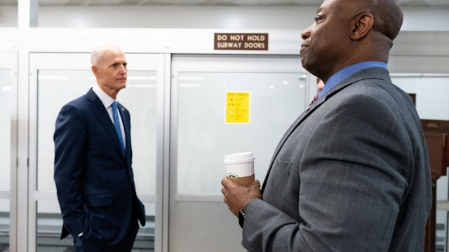 UNITED STATES - MARCH 30: Sen. .Rick Scott, R-Fla., left, and Sen. Tim Scott, R-S.C., wait for the Senate subway in the Capitol on Wednesday, March 30, 2022. (Bill Clark/CQ-Roll Call, Inc via Getty Images)