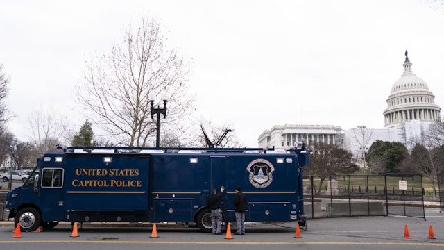 Security fencing and a United States Capitol Police trailer outside the US Capitol in Washington, DC, US, on Monday, Feb. 6, 2023. President Biden heads to Capitol Hill tomorrow to deliver the annual State of the Union address and is expected to tout better-than-expected job growth in his first speech to a divided Congress. Photographer: