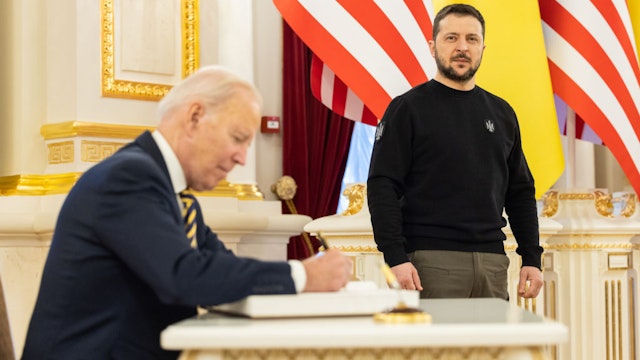 KYIV, UKRAINE - FEBRUARY 20: In this handout photo issued by the Ukrainian Presidential Press Office, U.S. President Joe Biden signs the guest book during a meeting with Ukrainian President Volodymyr Zelensky at the Ukrainian presidential palace on February 20, 2023 in Kyiv, Ukraine. The US President made his first visit to Kyiv since Russia's large-scale invasion last February 24. (Photo by Ukrainian Presidential Press Office via Getty Images)