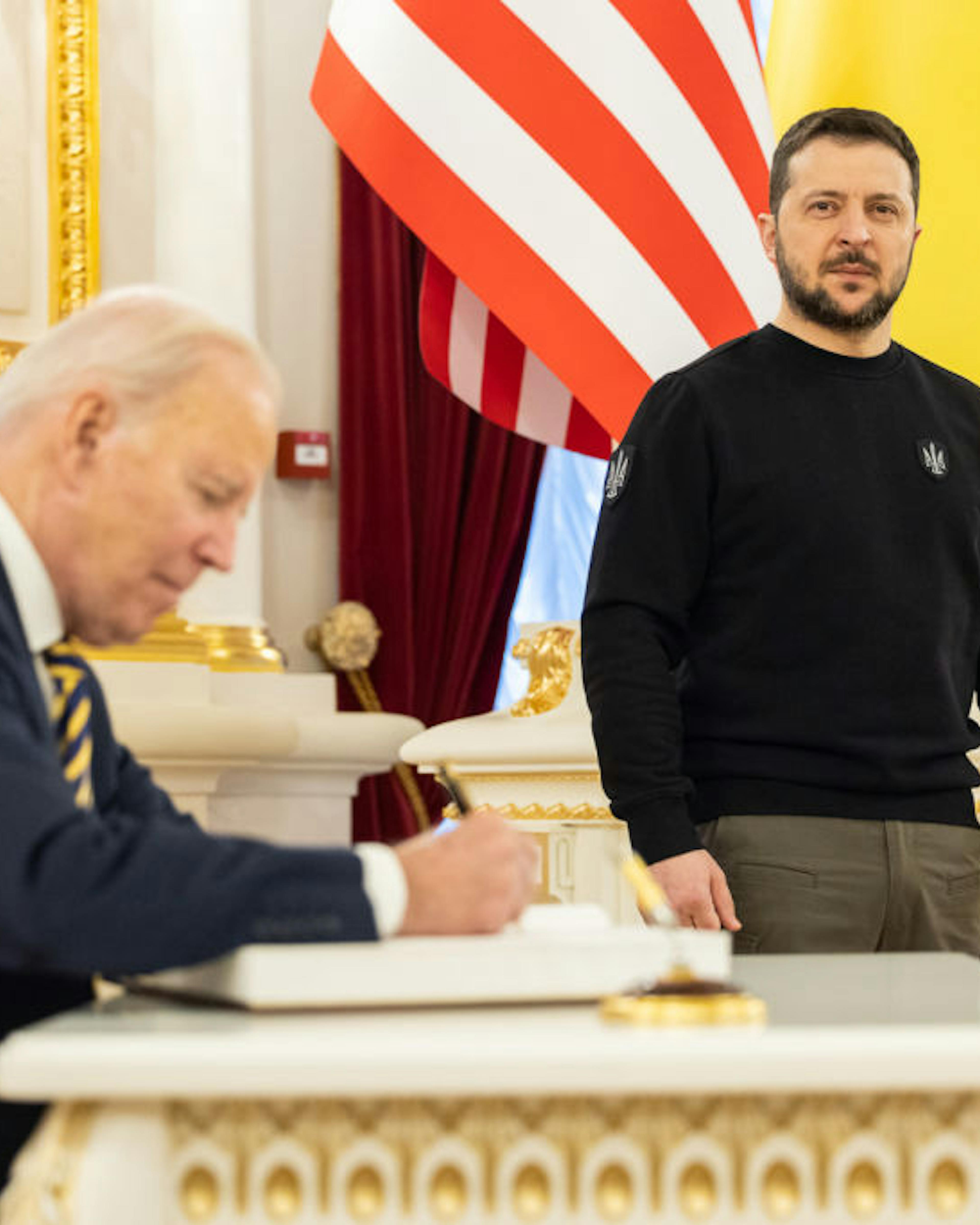 US President Biden Visits Kyiv KYIV, UKRAINE - FEBRUARY 20: In this handout photo issued by the Ukrainian Presidential Press Office, U.S. President Joe Biden signs the guest book during a meeting with Ukrainian President Volodymyr Zelensky at the Ukrainian presidential palace on February 20, 2023 in Kyiv, Ukraine. The US President made his first visit to Kyiv since Russia's large-scale invasion last February 24. (Photo by Ukrainian Presidential Press Office via Getty Images)