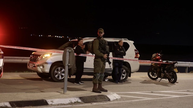 Israeli police inspect the crime scene after Jewish settler killed in shooting attack in Jericho, West Bank on February 27, 2023.