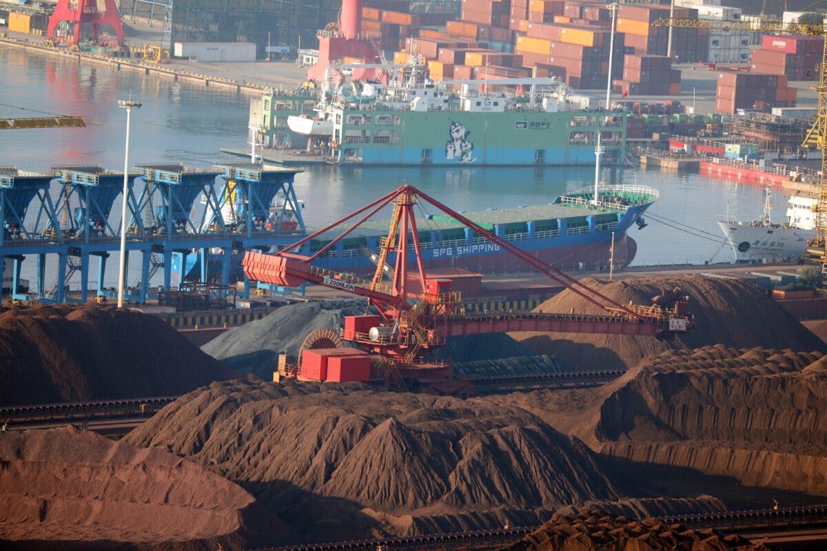 Iron ore sits in heaps at Rizhao Port on October 17, 2022 in Rizhao, Shandong Province of China.