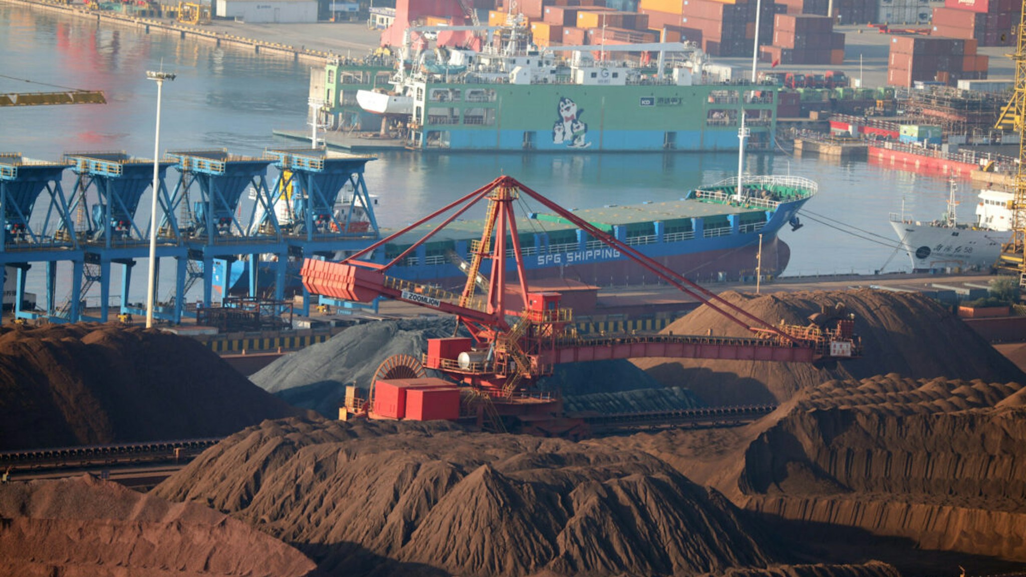 Iron ore sits in heaps at Rizhao Port on October 17, 2022 in Rizhao, Shandong Province of China.