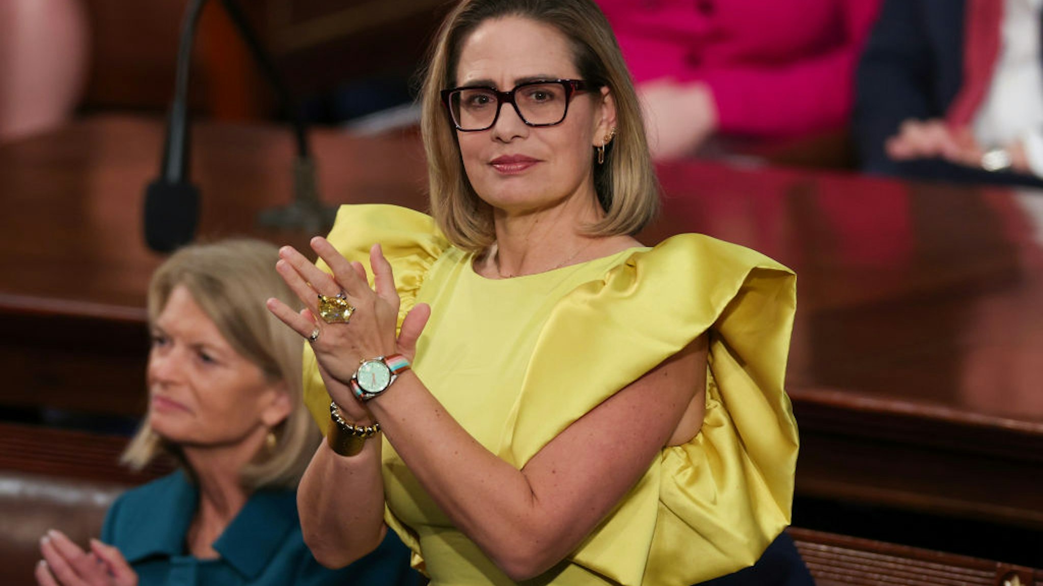WASHINGTON, DC - FEBRUARY 07: U.S. Sen. Kyrsten Sinema (I-AZ) applauds during U.S. President Joe Biden's State of the Union address during a joint meeting of Congress in the House Chamber of the U.S. Capitol on February 07, 2023 in Washington, DC. The speech marks Biden's first address to the new Republican-controlled House. (Photo by Win McNamee/Getty Images)