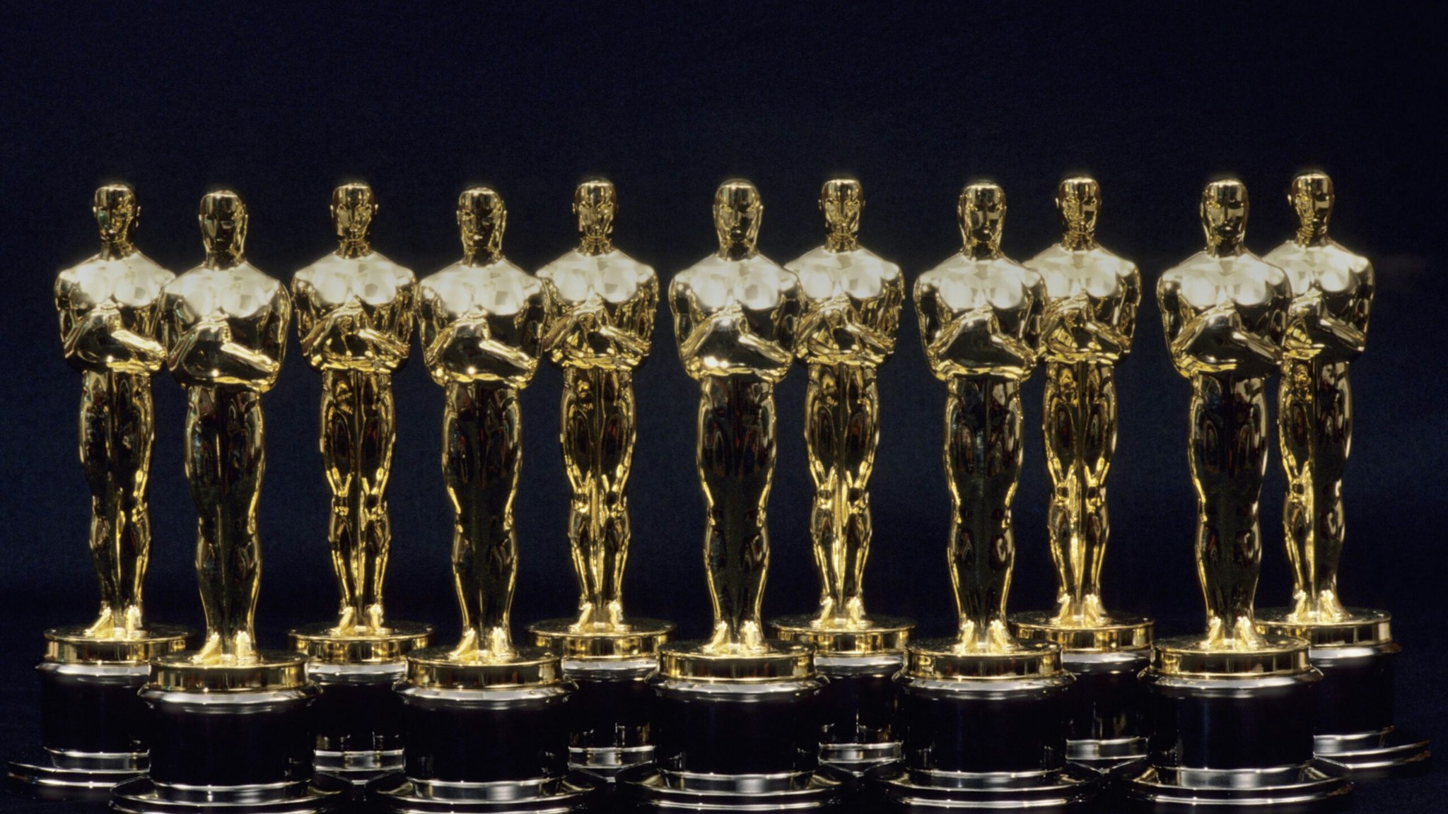 A view of 11 Oscars statues lined up next to each other in 1990 in Los Angeles, California.