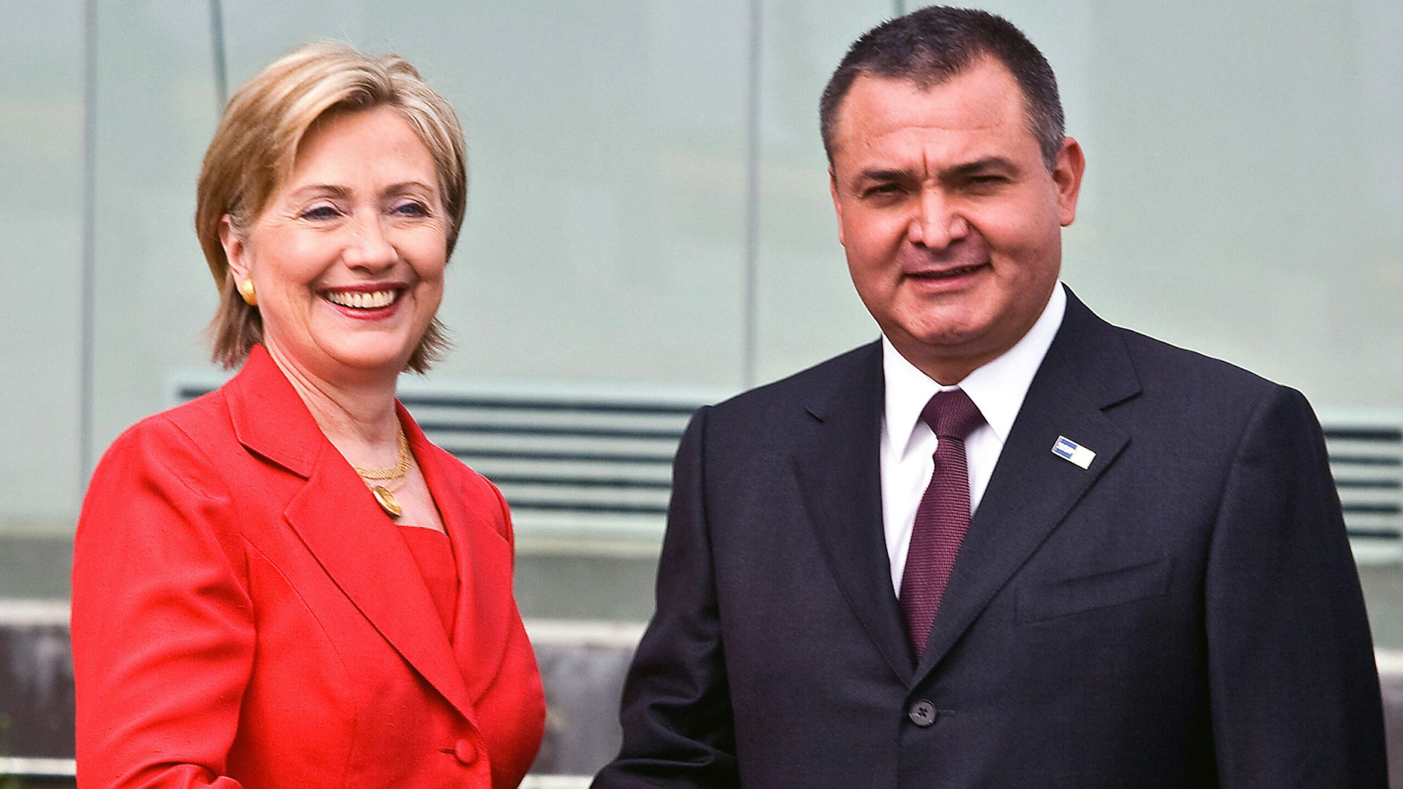 US Secretary of State Hillary Clinton shakes hands with the Secretary of the Federal Public Security Genaro Garcia Luna upon her arrival to the Center Command of the Mexican Federal Police in Mexico City, on March 26, 2009. Clinton is in Mexico for a two-day visit.
