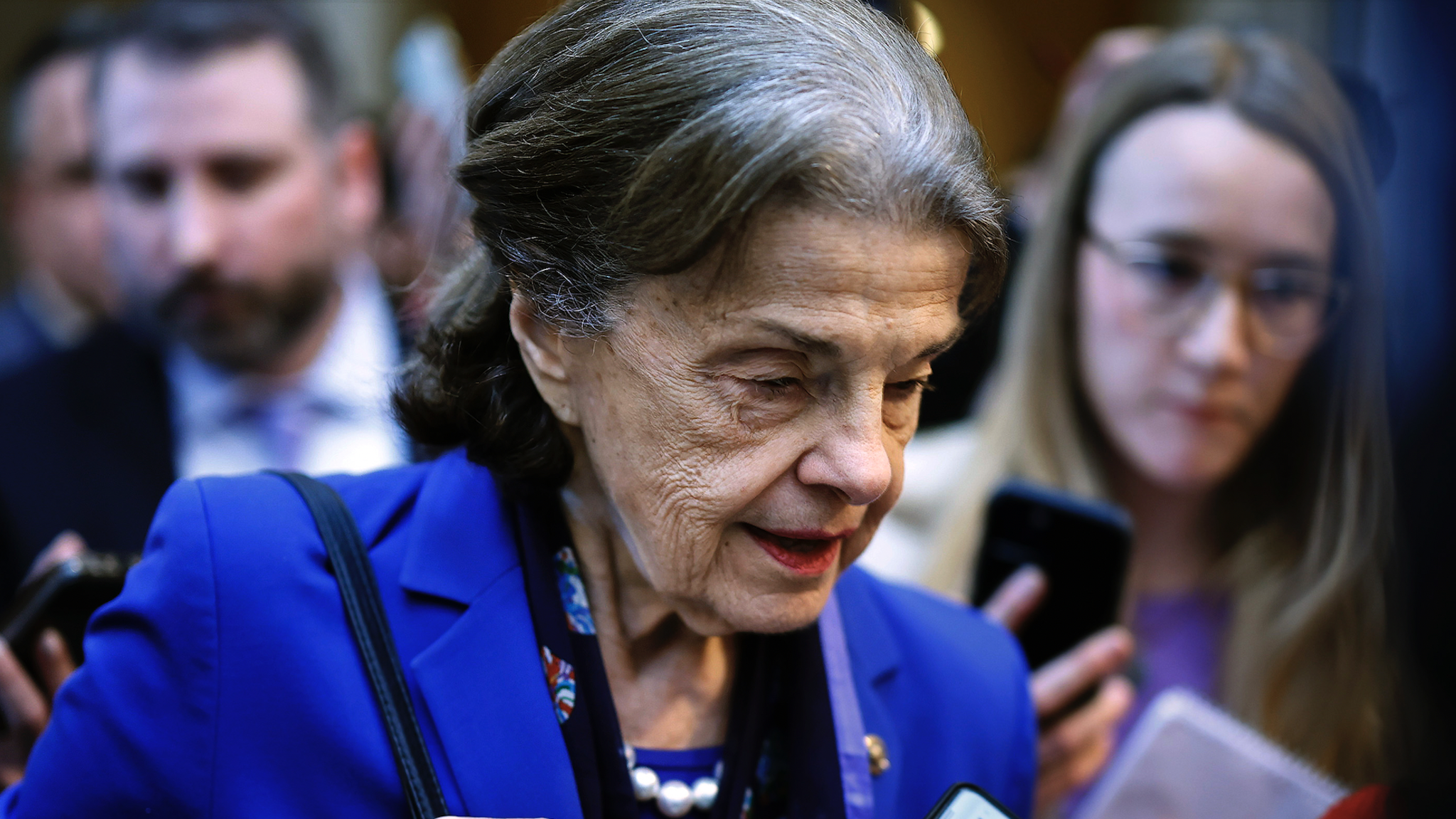 WASHINGTON, DC - FEBRUARY 14: Sen. Dianne Feinstein (D-CA) is surrounded by reporters as she heads to the Senate Chamber for a vote in the U.S. Capitol on February 14, 2023 in Washington, DC. Feinstein announced Tuesday that she will not seek re-election in 2024