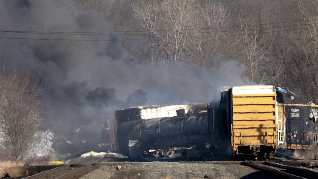 Smoke rises from a derailed cargo train in East Palestine, Ohio, on February 4, 2023. - The train accident sparked a massive fire and evacuation orders, officials and reports said Saturday. No injuries or fatalities were reported after the 50-car train came off the tracks late February 3 near the Ohio-Pennsylvania state border. The train was shipping cargo from Madison, Illinois, to Conway, Pennsylvania, when it derailed in East Palestine, Ohio.