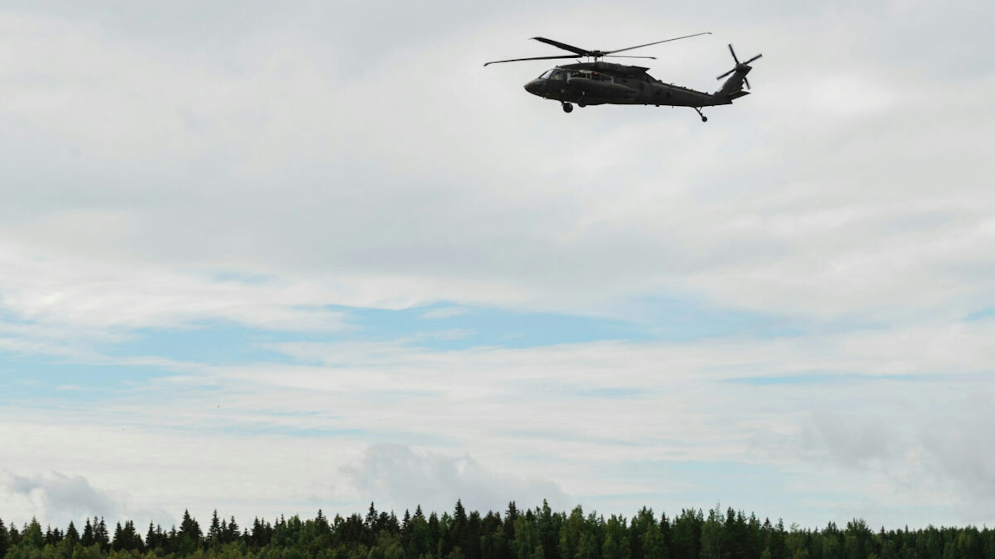 A Sikorsky UH-60 Black Hawk helicopter from US army aviation, 12th Combat Aviation Brigade, taking part in a joint military helicopter training exercise hosted by the Finnish Army's Utti Jaeger Regiment in Pirkkala, Finland, on Wednesday, Aug. 3, 2022