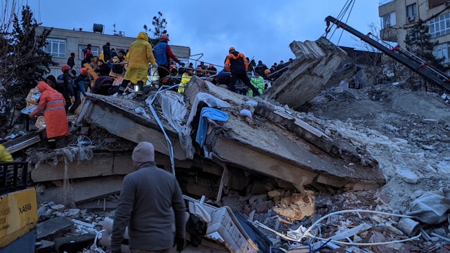 Rescue workers and volunteers search for survivors in the rubble of a collasped building, in Sanliurfa, Turkey, on February 6, 2023, after a 7.8-magnitude earthquake struck the country's south-east. - The combined death toll has risen to over 2,300 for Turkey and Syria after the region's strongest quake in nearly a century. Turkey's emergency services said at least 1,121 people died in the earthquake, with another 783 confirmed fatalities in Syria.