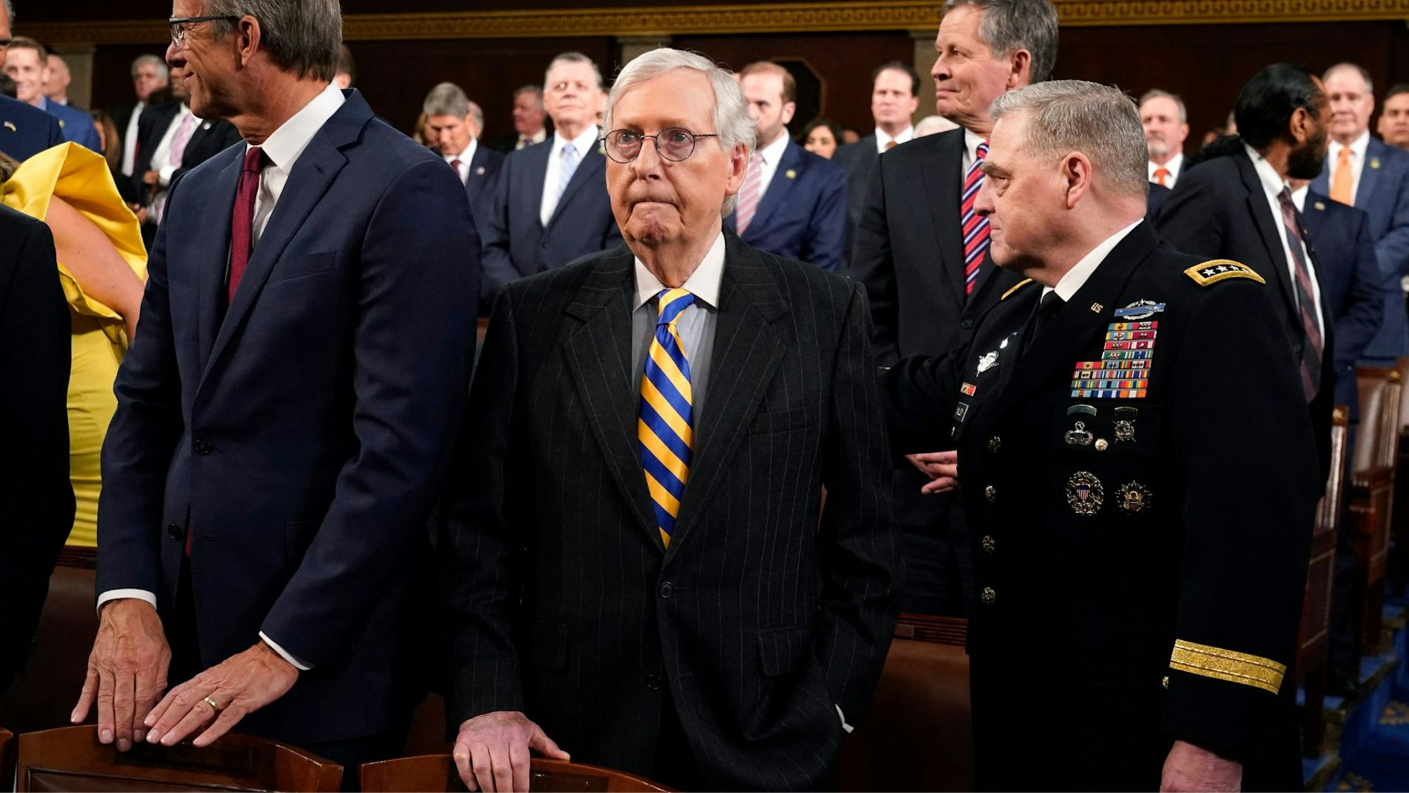 Senate Minority Leader Mitch McConnell (R-KY), arrives with Chairman of the Joint Chiefs of Staff General Mark Milley (R) before President Joe Biden delivers the State of the Union address in the House Chamber of the US Capitol in Washington, DC, on February 7, 2023.