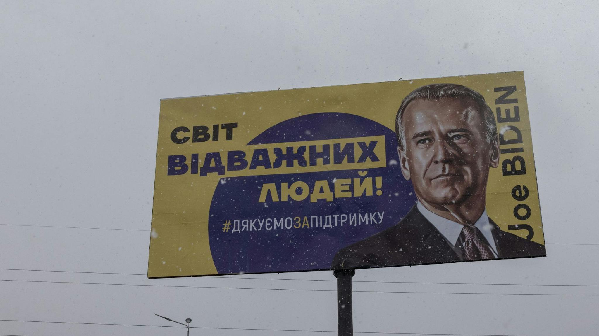 Joe Biden BUCHA, UKRAINE - FEBRUARY 1: A banner depicting U.S. President Joe Biden with Ukrainian words reading as: The world of brave people! #Thank you for the support, on February 1, 2023 in Bucha, outside Kyiv, Ukraine. February 24 will mark one year since Russia's large-scale invasion of Ukraine. In the time since, fighting has largely concentrated in the east and south of the country, but the capital remains the target of regular air strikes.