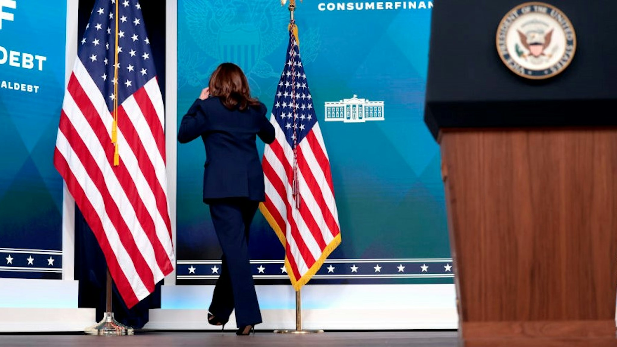 WASHINGTON, DC - APRIL 11: U.S. Vice President Kamala Harris walks offstage after delivering remarks on medical debt in the South Court Auditorium of the White House on April 11, 2022 in Washington, DC. During the remarks Vice President Harris, along with other administrative officials, announced new actions the Biden administration was taking to help people in the United States struggling with medical debt. (Photo by
