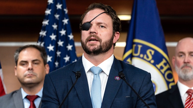 Representative Dan Crenshaw, a Republican from Texas, speaks during a news conference organized by House Republican veterans at the US Capitol in Washington, DC, US, on Wednesday, Jan. 4, 2023. House GOP leader Kevin McCarthy suffered yet another stunning blow at the hands of a group of Republican dissidents, who blocked him from becoming speaker in a sixth round of voting and turned the first days of the party's control of the chamber into a scene of chaos and dysfunction.