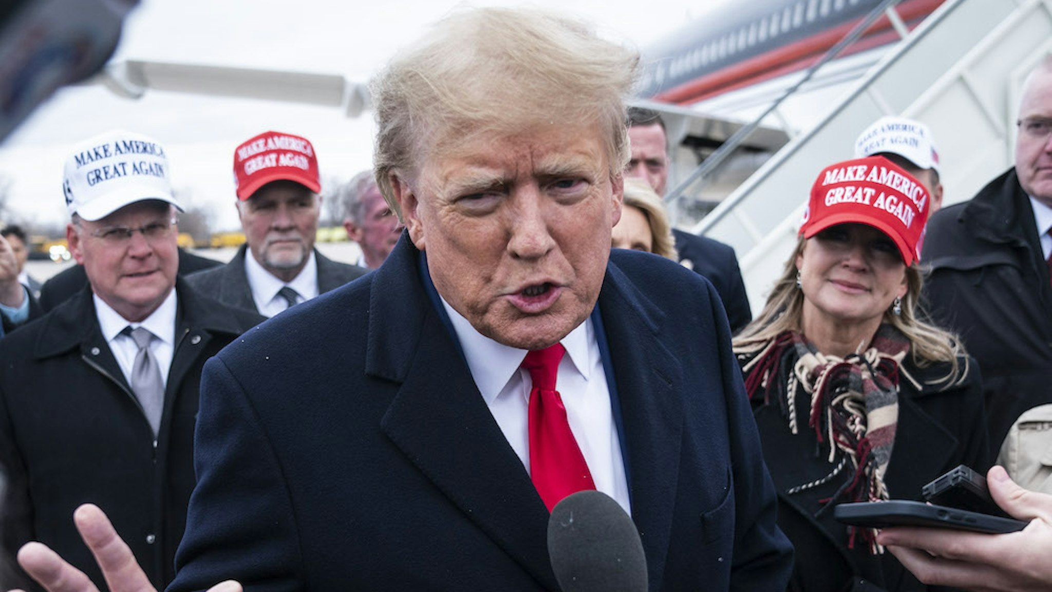 Moline, IL - March 13 : Former President Donald Trump speaks with reporters as he lands at Quad City International Airport in route to Iowa on Monday, March 13, 2023, in Moline, IL. (Photo by Jabin Botsford/The Washington Post via Getty Images)