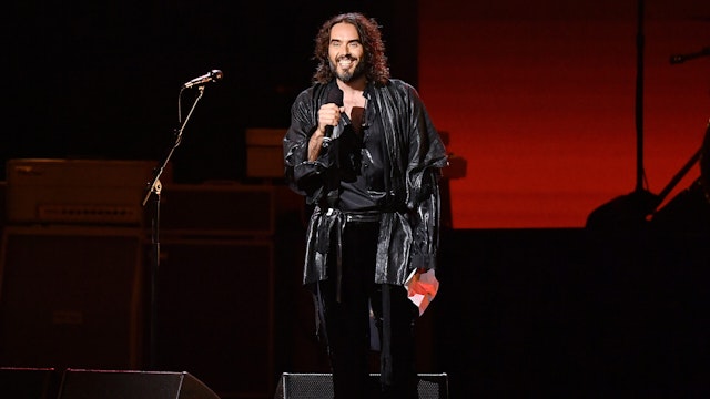 LOS ANGELES, CALIFORNIA - JANUARY 24: Host Russell Brand speaks onstage during MusiCares Person of the Year honoring Aerosmith at West Hall at Los Angeles Convention Center on January 24, 2020 in Los Angeles, California. (Photo by Amy Sussman/Getty Images)