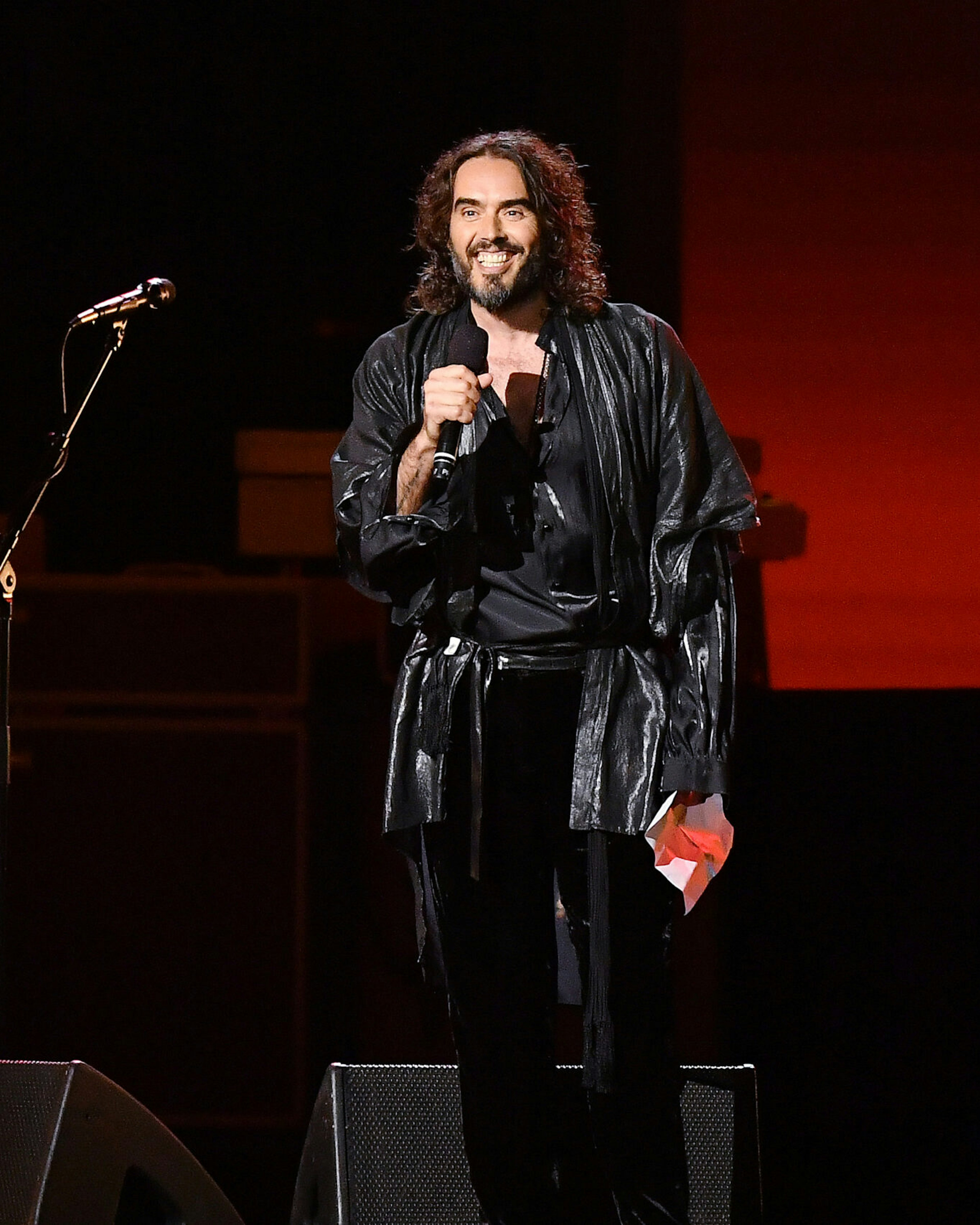 LOS ANGELES, CALIFORNIA - JANUARY 24: Host Russell Brand speaks onstage during MusiCares Person of the Year honoring Aerosmith at West Hall at Los Angeles Convention Center on January 24, 2020 in Los Angeles, California. (Photo by Amy Sussman/Getty Images)