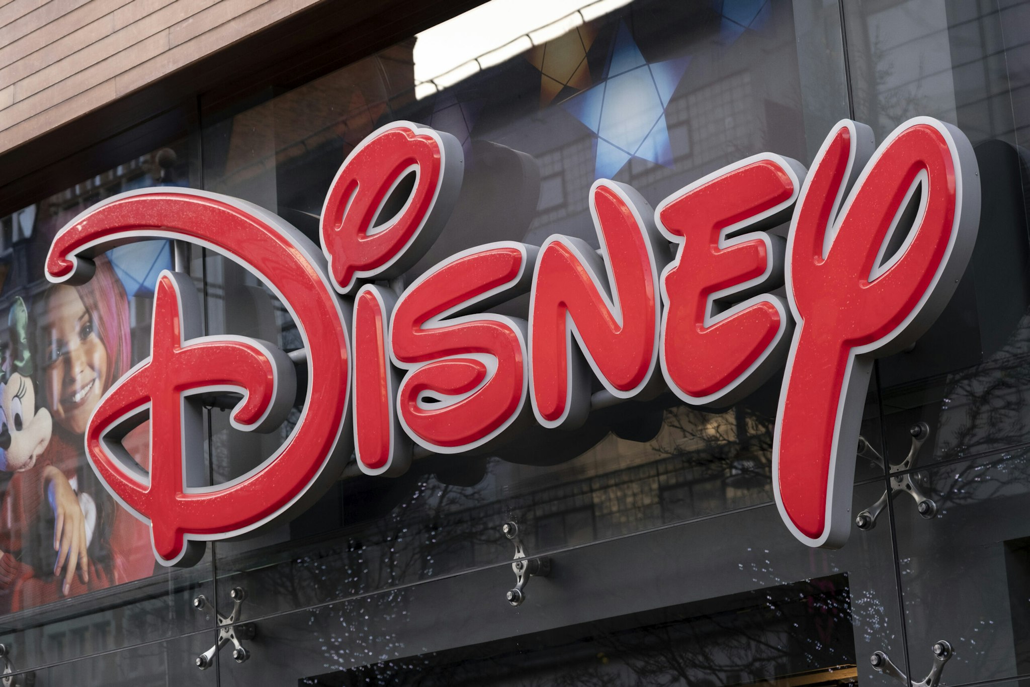 Sign for the media brand Disney Store on 19th December 2020 in London, United Kingdom. The Walt Disney Company, commonly known as Walt Disney or simply Disney, is an American diversified multinational mass media and entertainment conglomerate.