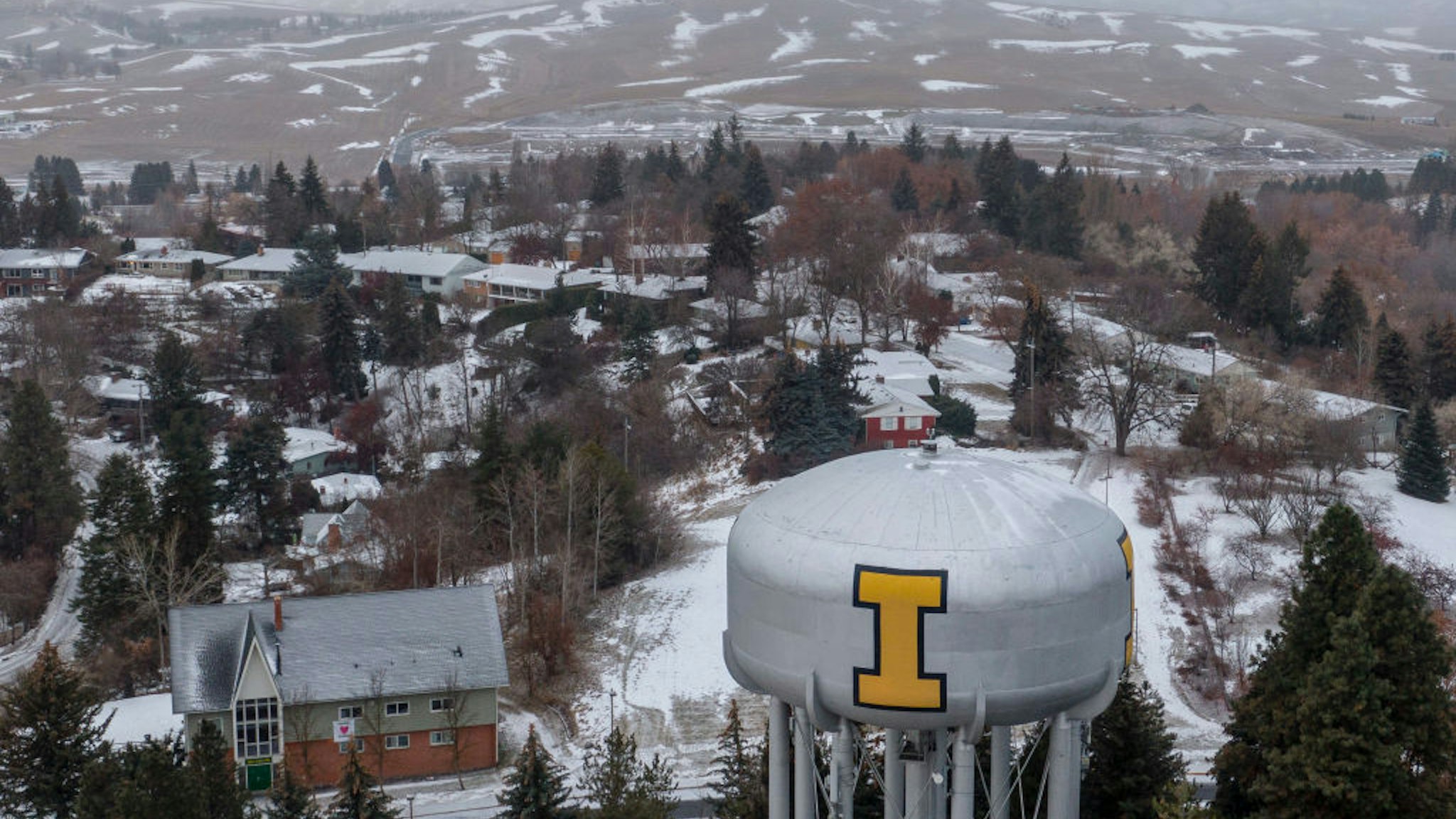 In this aerial view, the town of Moscow is seen near the neighborhood of a home that is the site of a quadruple murder on January 3, 2023 in Moscow, Idaho.