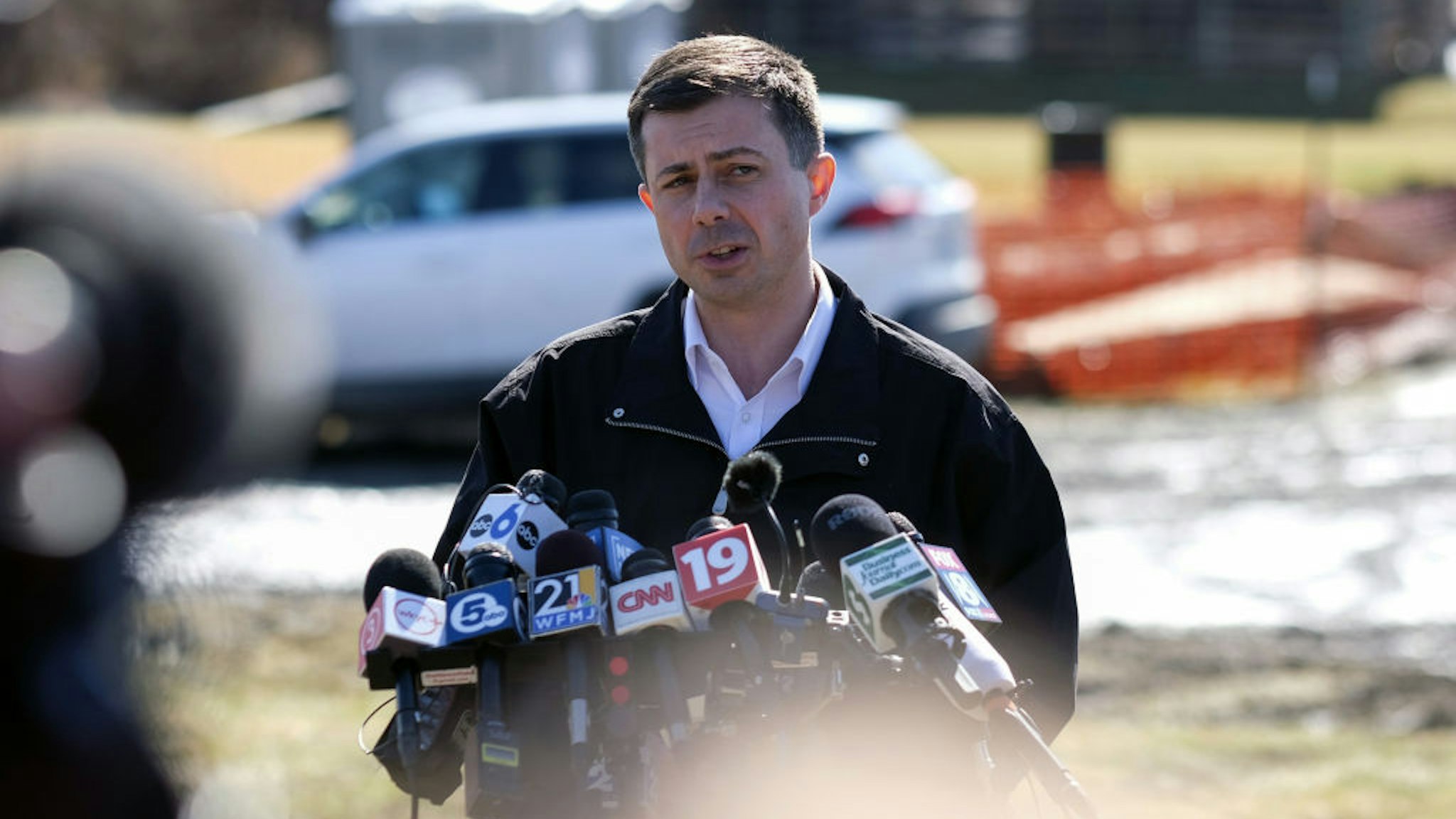 Pete Buttigieg, US transportation secretary, speaks during a news conference near the site of the Norfolk Southern train derailment in East Palestine, Ohio, US, on Thursday, Feb. 23, 2023. Buttigieg traveled to East Palestine, Ohio, on Thursday, as the Biden administration hastens its response to a fiery train crash earlier this month that spread toxic chemicals and has become a flashpoint in the upcoming presidential election. Photographer: Matthew Hatcher/Bloomberg via Getty Images