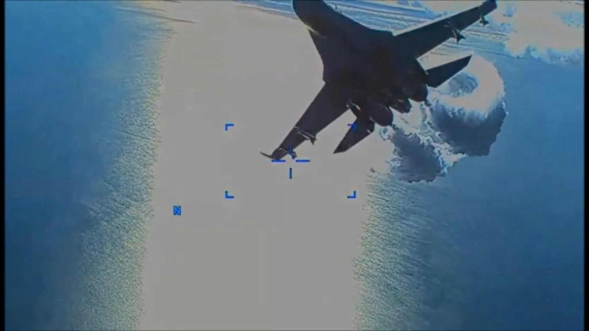 BLACK SEA - MARCH 14: (----EDITORIAL USE ONLY - MANDATORY CREDIT - "UNITED STATES EUROPEAN COMMAND/ HANDOUT" - NO MARKETING NO ADVERTISING CAMPAIGNS - DISTRIBUTED AS A SERVICE TO CLIENTS----) A screen grab captured from a video shows US drone is being harassed by Russian Su-27 fighter jet over Black Sea before it was downed on March 14, 2023. The drone was conducting reconnaissance when one of the SU-27 jets struck the propeller of the MQ-9 Reaper at roughly 7.03 a.m. CET (0603GMT) on Tuesday, prompting the drone's operators to bring it down in international waters. (Photo by United States European Command/Anadolu Agency via Getty Images)