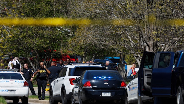 NASHVILLE, TN - MARCH 27: Police work near the scene of a mass shooting at the Covenant School on March 27, 2023 in Nashville, Tennessee. A 28-year-old former female student at the private Christian school, wielding a handgun and two AR-style weapons, shot and killed three 9-year-old students and three adults before being killed by responding police officers, according to published reports. (Photo by Brett Carlsen/Getty Images)