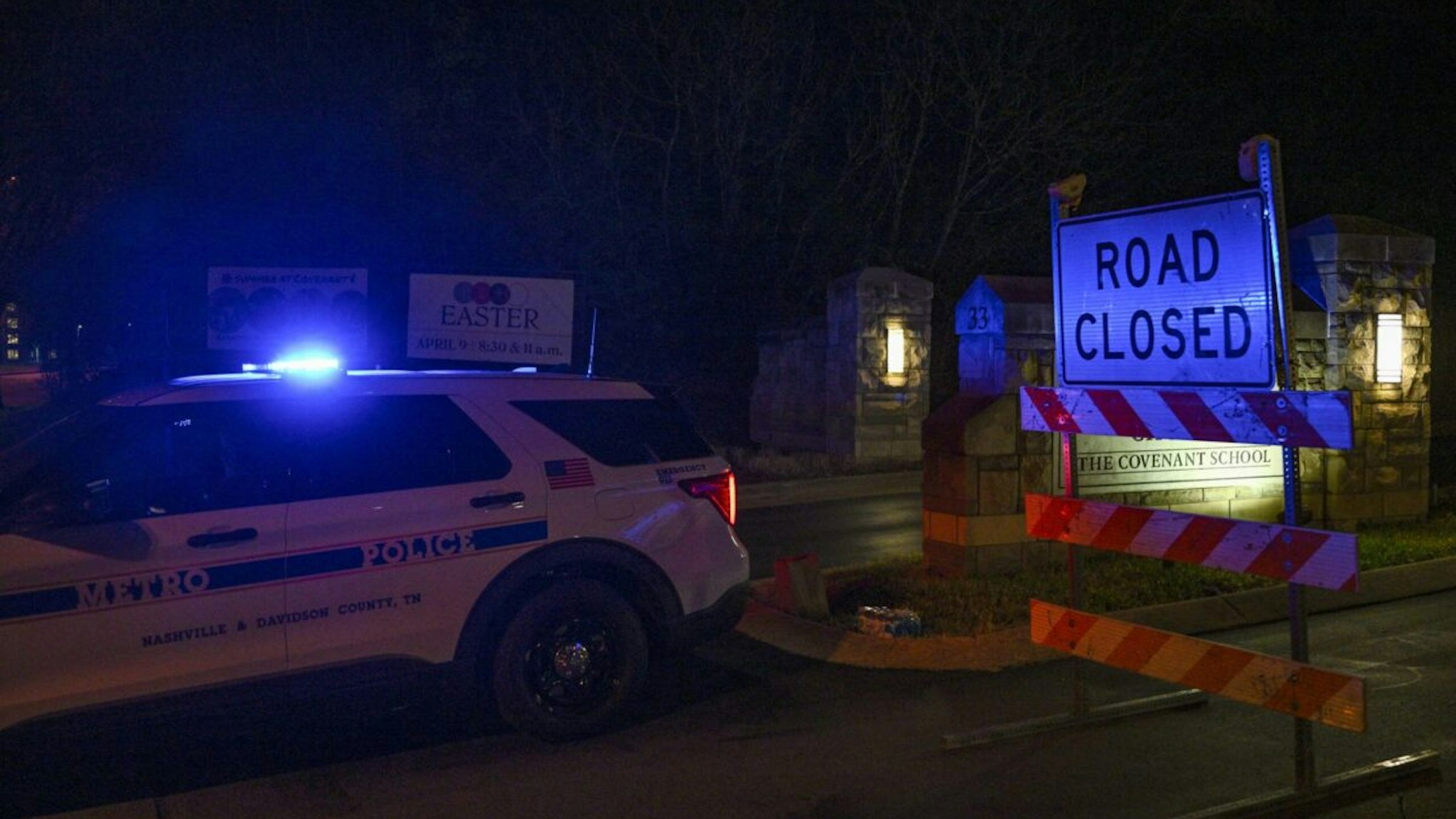 A police car blocks access to the Covenant School building at the Covenant Presbyterian Church, in Nashville, Tennessee, March 27, 2023. - A heavily armed former student killed three young children and three staff in what appeared to be a carefully planned attack at a private elementary school in Nashville on Monday, before being shot dead by police. Chief of Police John Drake named the suspect as Audrey Hale, 28, who the officer later said identified as transgender.