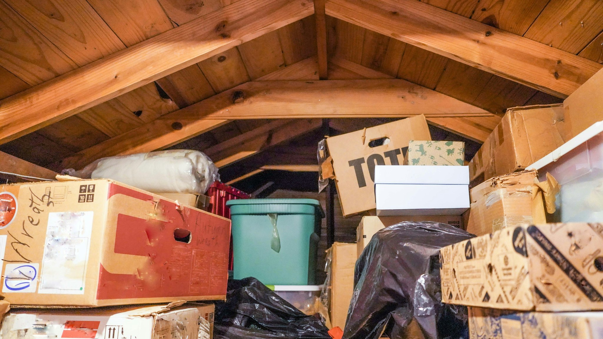 A disorganized attic. loft, or crawl-space above the residential garage.