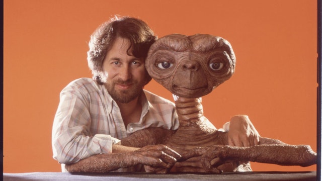 Director Steven Spielberg poses with E.T. at Carlo Rimbaldi studio in April, 1982 in Los Angeles, California. (Photo by