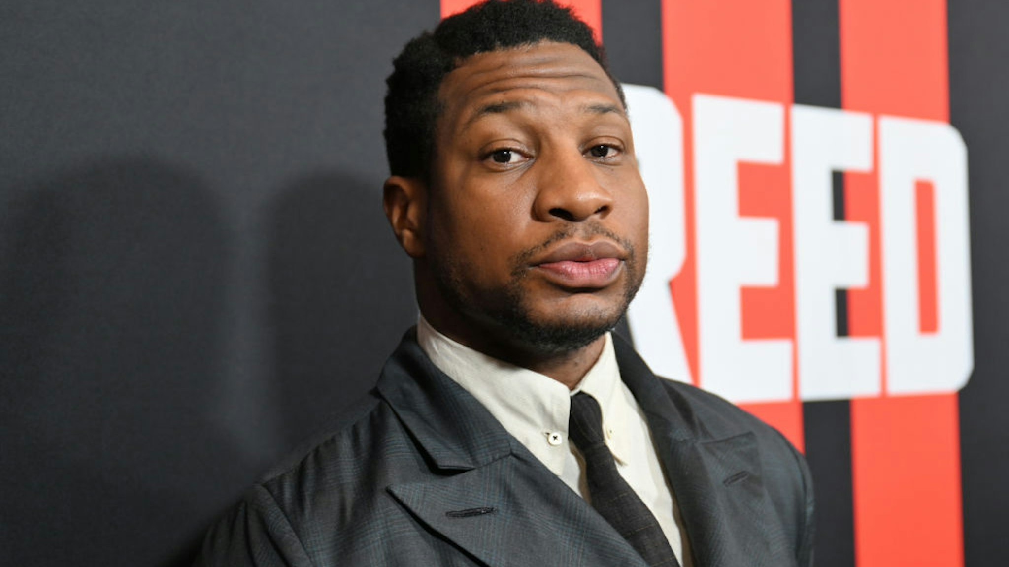 ATLANTA, GEORGIA - FEBRUARY 23: Jonathan Majors attends the CREED III HBCU fan screening presented by MGM Studios at Regal Atlantic Station on February 23, 2023 in Atlanta, Georgia. (Photo by Paras Griffin/Getty Images for MGM Studios)