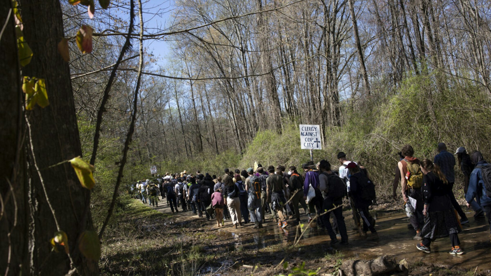 Environmental activists hold a rally and a march through the Atlanta Forest, a preserved forest Atlanta that is scheduled to be developed as a police training center, March 4, 2023 in Atlanta, Georgia.