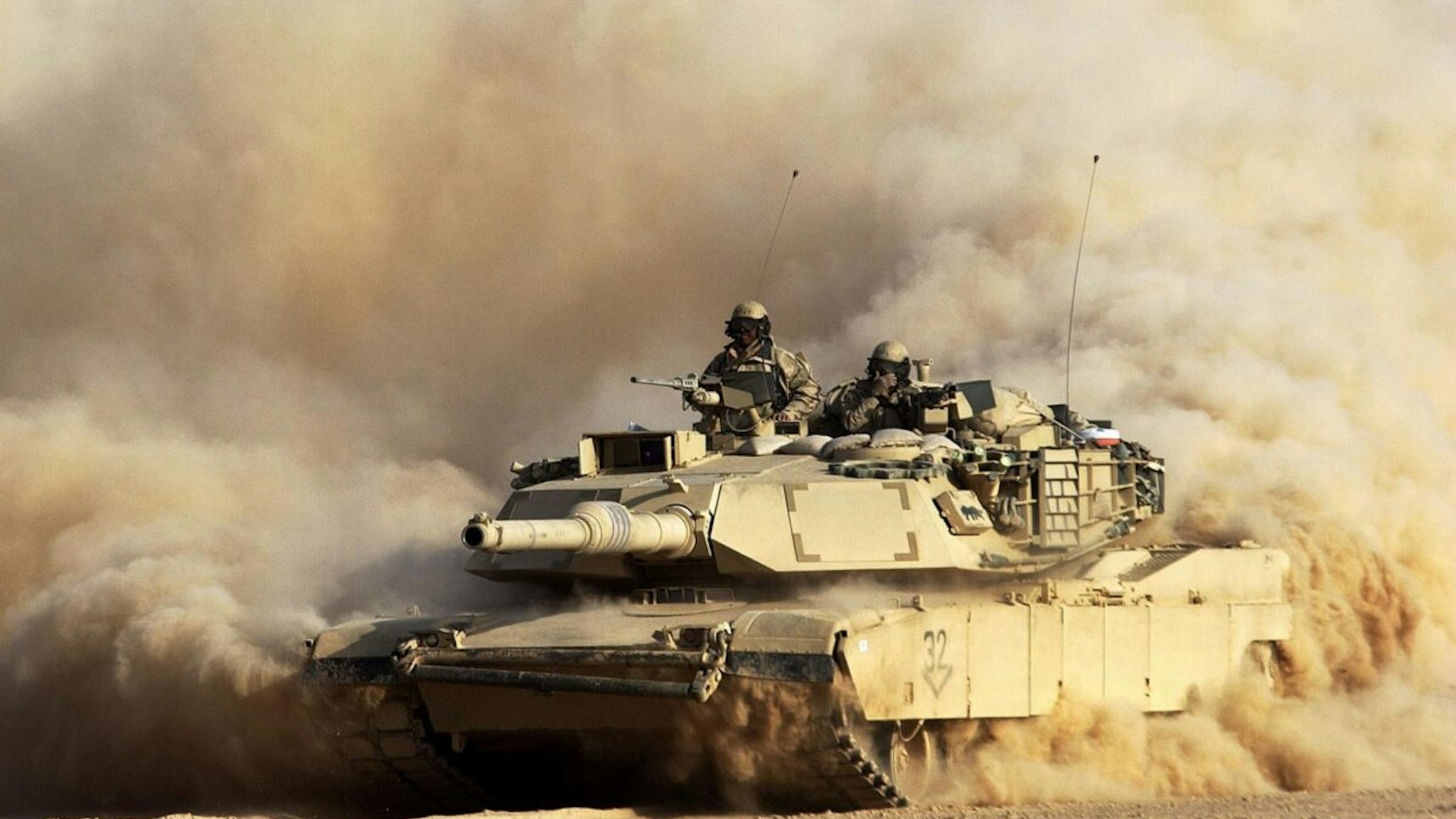 A U.S. Army 3rd Infantry Division M1/A1 Abrahms tank rolls deeper into Iraqi territory March 23, 2003 south of the city of An Najaf, Iraq. U.S. and British forces continue to assault Iraq from land, sea and air as part of the ongoing Operation Iraqi Freedom.
