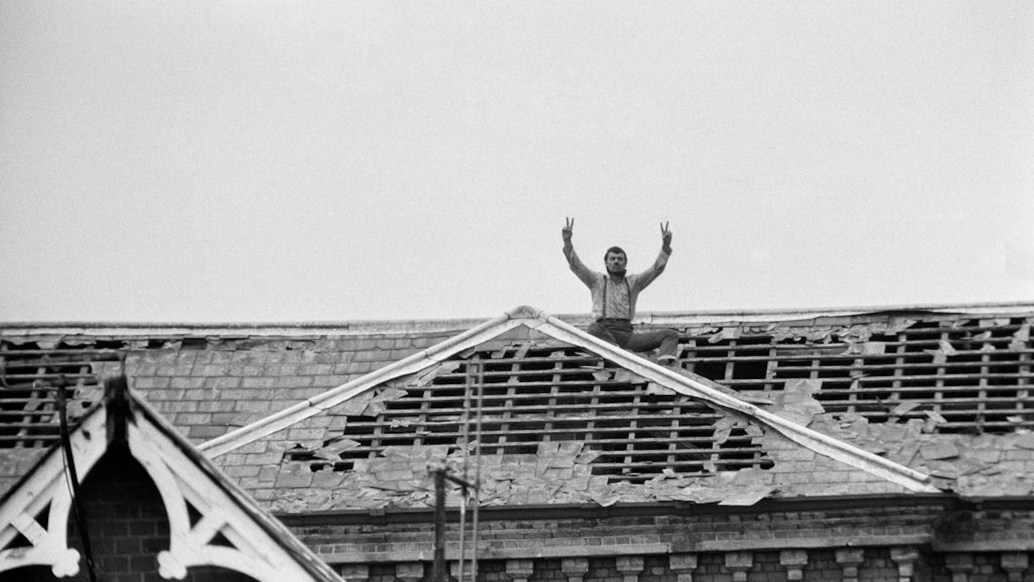 Michael Peterson (aka Charles Bronson) stages a protest on the roof of Broadmoor Hospital.