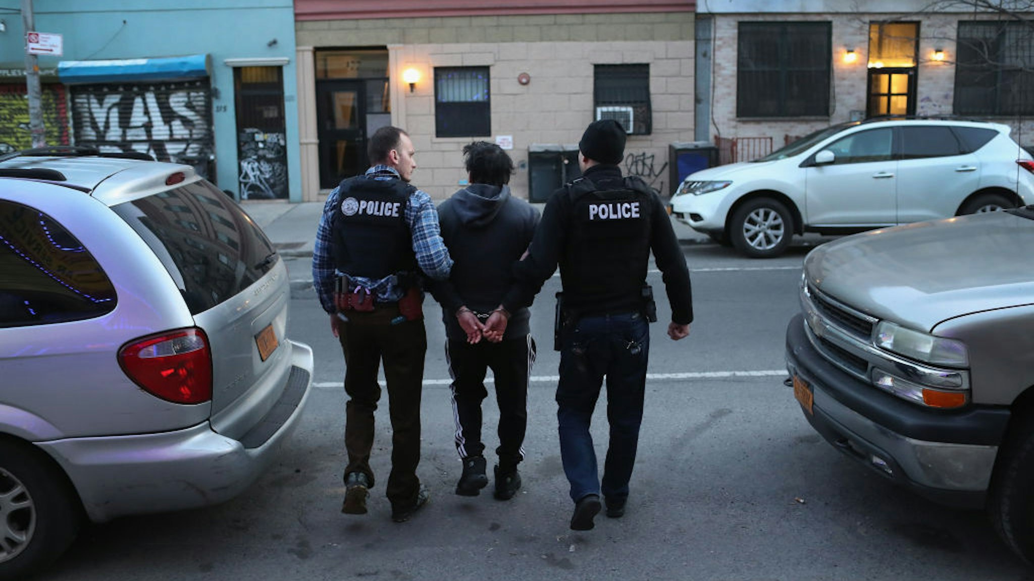 NEW YORK, NY - APRIL 11: U.S. Immigration and Customs Enforcement (ICE), officers arrest an undocumented Mexican immigrant during a raid in the Bushwick neighborhood of Brooklyn on April 11, 2018 in New York City. New York is considered a "sanctuary city" for undocumented immigrants, and ICE receives little or no cooperation from local law enforcement. ICE said that officers arrested 225 people for violation of immigration laws during the 6-day operation, the largest in New York City in recent years. (Photo by John Moore/Getty Images)