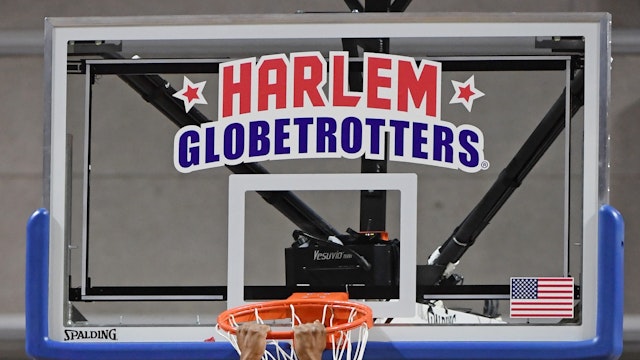 Antjuan "Clutch" Ball #48 of the Harlem Globetrotters jumps off the rim during the team's exhibition game against the Washington Generals at the Orleans Arena on August 25, 2019 in Las Vegas, Nevada.