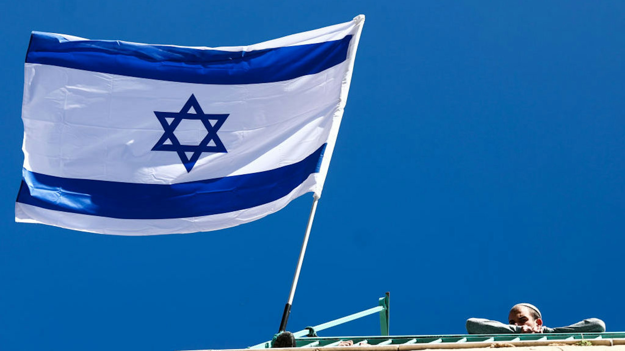 Israeli flag is seen in the Old City in Jerusalem, Israel on December 29, 2022. (Photo by Jakub Porzycki/NurPhoto)