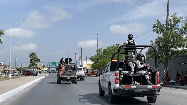 National Guard and military vehicles take part in an operation to transfer two of the four US citizens kidnapped in Mexico's crime-ridden northeast, back to Brownsville in the US, after the other two were found dead, in Matamoros, Tamaulipas State, Mexico, on March 7, 2023. - Two of the four US citizens kidnapped in crime-plagued northeastern Mexico were found dead Tuesday, prompting a vow by Washington to ensure that the perpetrators are brought to justice. The two others were located alive several days after the group was snatched at gunpoint in the city of Matamoros, having apparently crossed the border for medical reasons, Mexican authorities said. (Photo by AFP) (Photo by STR/AFP via Getty Images)