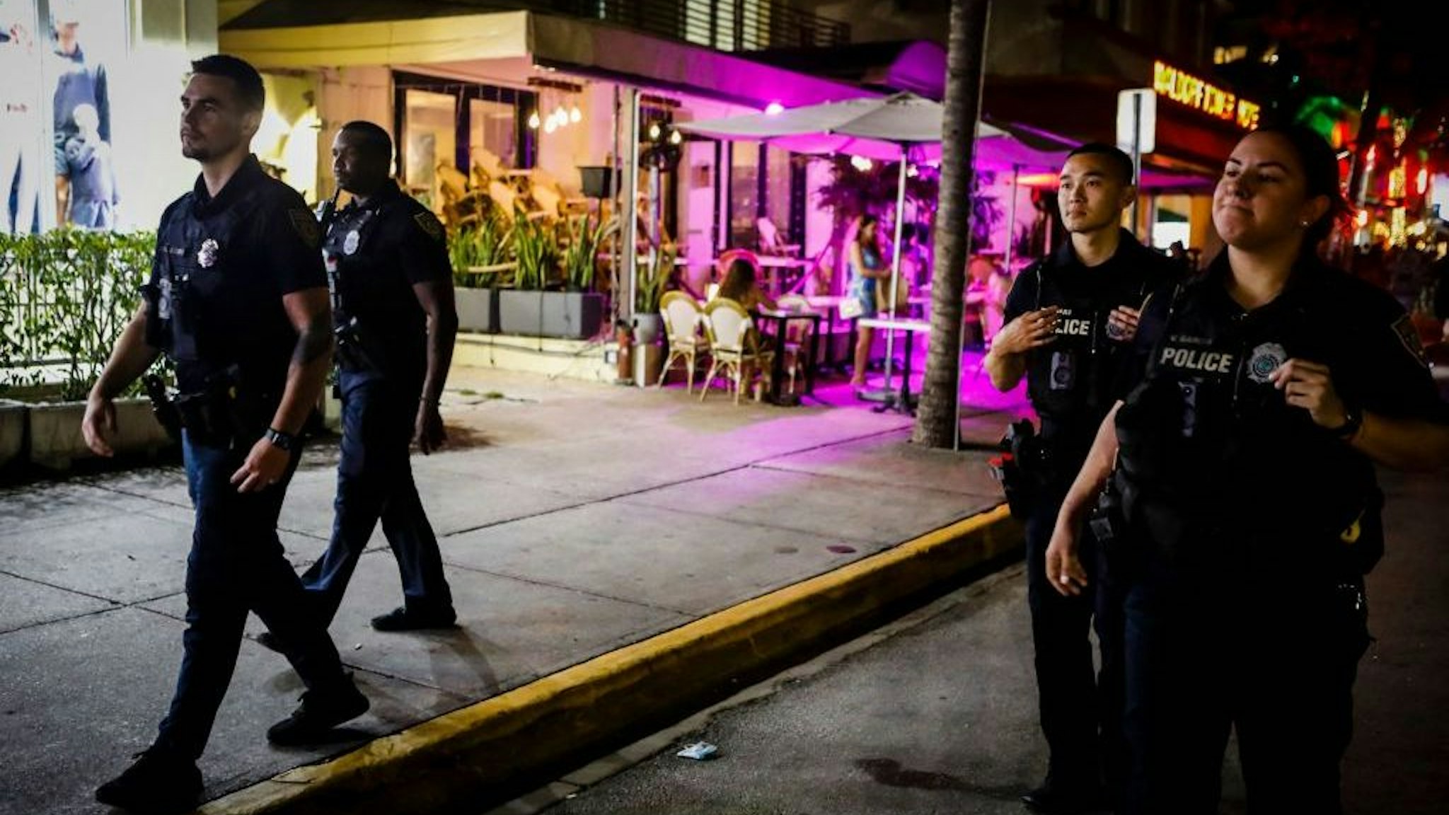 Miami Beach Police patrol Ocean Drive before a curfew goes into effect during Spring Break in Miami Beach, Florida, on March 24, 2022. - The US city of Miami Beach has declared a state of emergency and will impose a curfew this weekend to stem a wave of violence linked to the influx of revellers to Florida for spring break. (Photo by Eva Marie UZCATEGUI / AFP) (Photo by EVA MARIE UZCATEGUI/AFP via Getty Images)